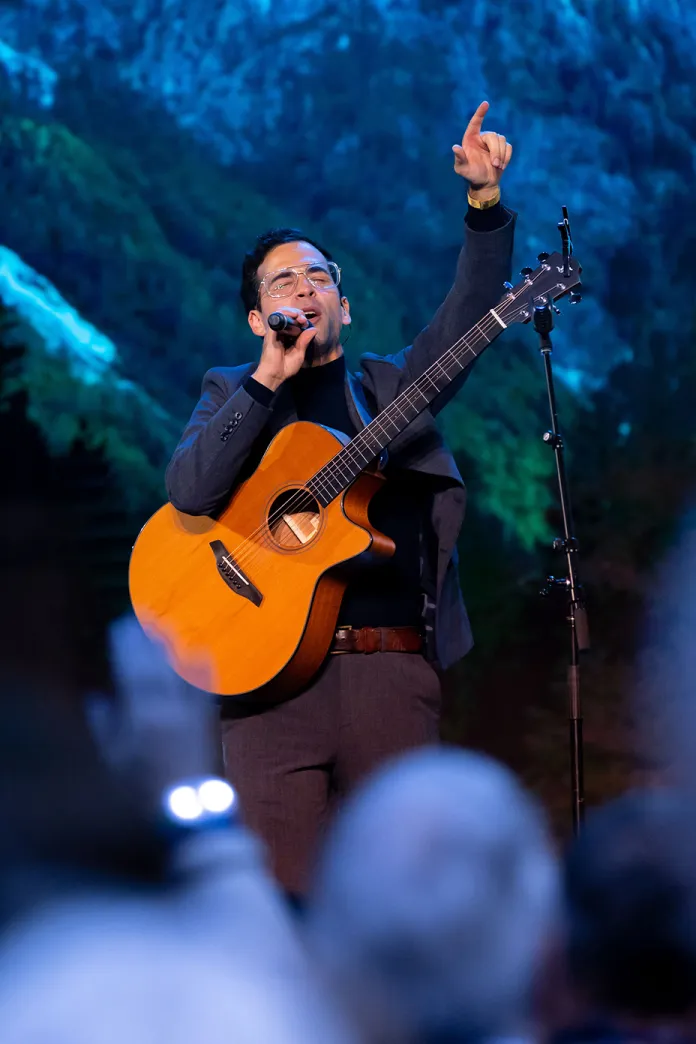Michael Sanchez singing and playing guitar